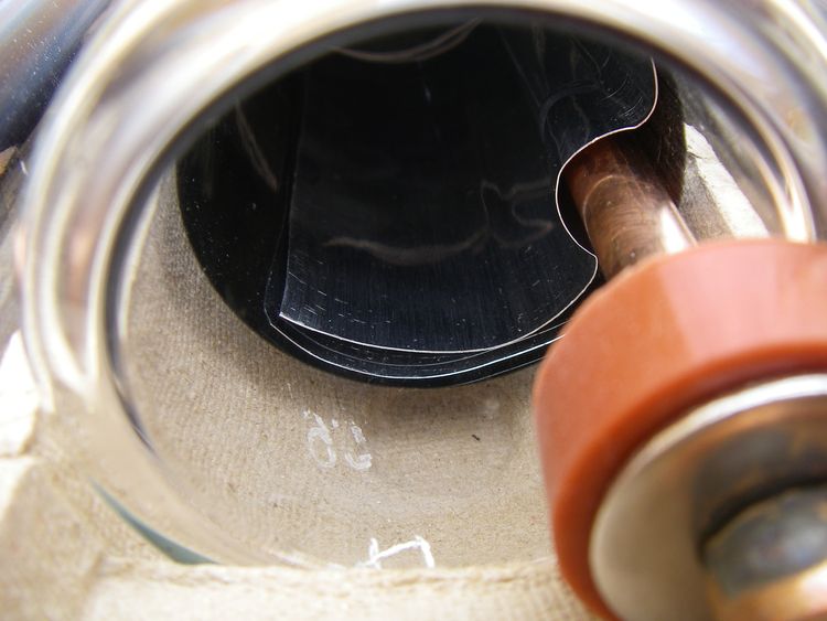 Looking into an evacuated solar tube: the dark absorber fin and the copper heat pipe inside the glass